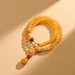 Elevate your spiritual journey with this Natural Xinjiang Golden Silk Jade Multi-wrap Bracelet. Handcrafted with premium golden silk jade and a classic peace buckle pendant, this New Chinese style mala beads bracelet blends ethnic charm with modern elegance. Believed to ground energy, soothe anxiety, and bring lasting peace, this unisex bracelet is perfect for daily wear, meditation, or as a meaningful spiritual gift.